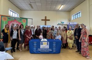 Group shot of people celebrating the BME dementia service's 10 year anniversary